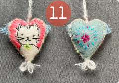 new batch! heavily stitched dog & cat wool felt hearts (fundraiser for pasadena humane)