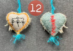 new batch! heavily stitched dog & cat wool felt hearts (fundraiser for pasadena humane)