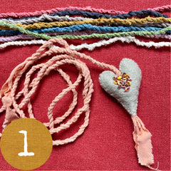 beaded plant-dyed wool felt hearts on silk cordage