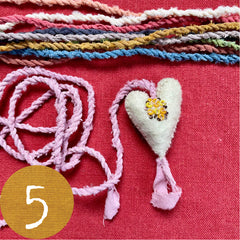 beaded plant-dyed wool felt hearts on silk cordage