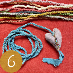 beaded plant-dyed wool felt hearts on silk cordage