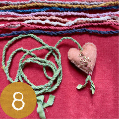 beaded plant-dyed wool felt hearts on silk cordage