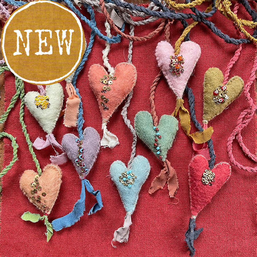 beaded plant-dyed wool felt hearts on silk cordage