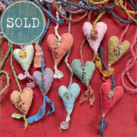 beaded plant-dyed wool felt hearts on silk cordage