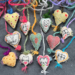 new batch! heavily stitched dog & cat wool felt hearts (fundraiser for pasadena humane)