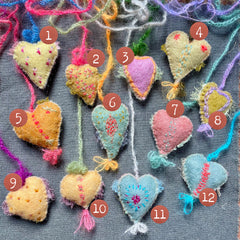 new batch! heavily stitched dog & cat wool felt hearts (fundraiser for pasadena humane)