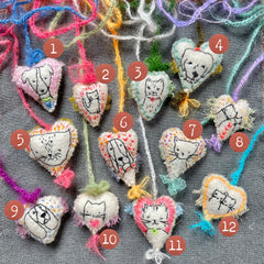 new batch! heavily stitched dog & cat wool felt hearts (fundraiser for pasadena humane)