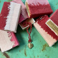 choker necklace in a plant-dyed matchbox: basin, leaf & pebble