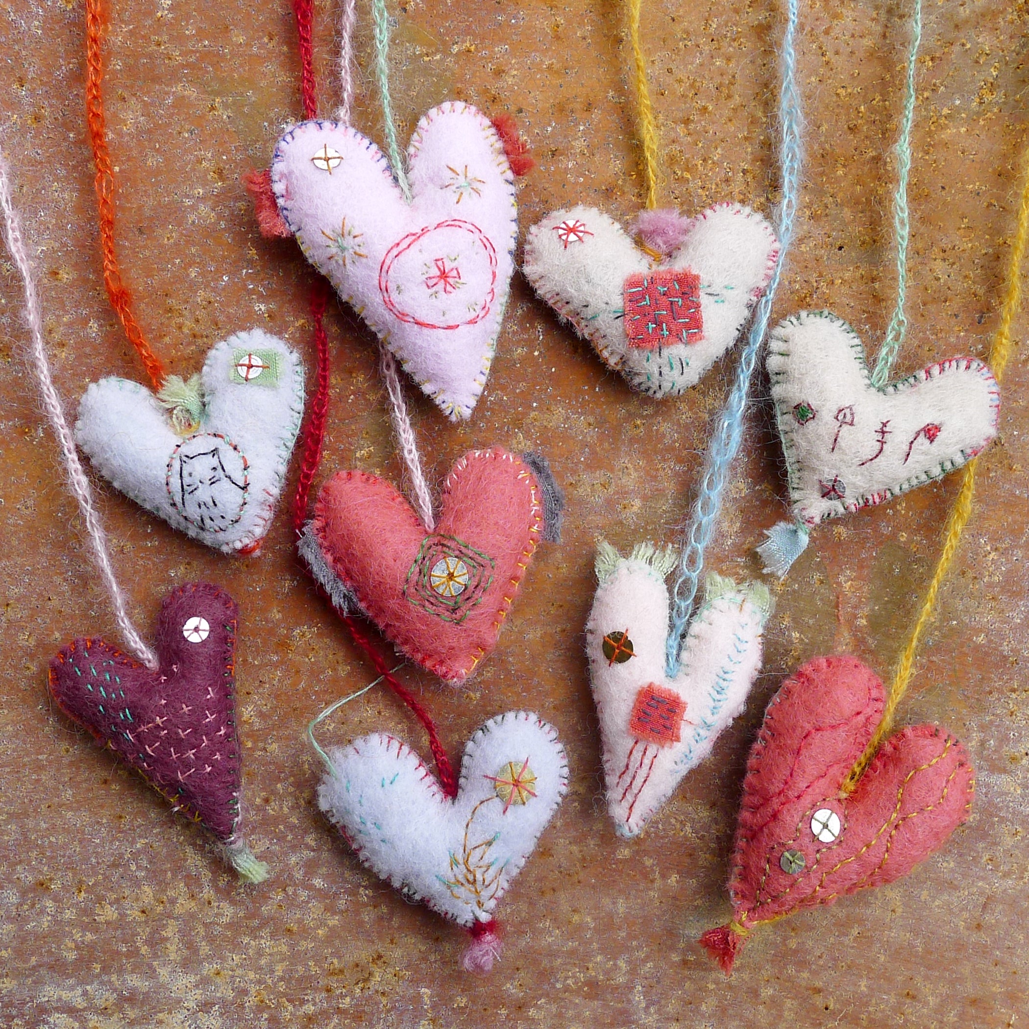 heavily stitched wool felt hearts – kata golda handmade